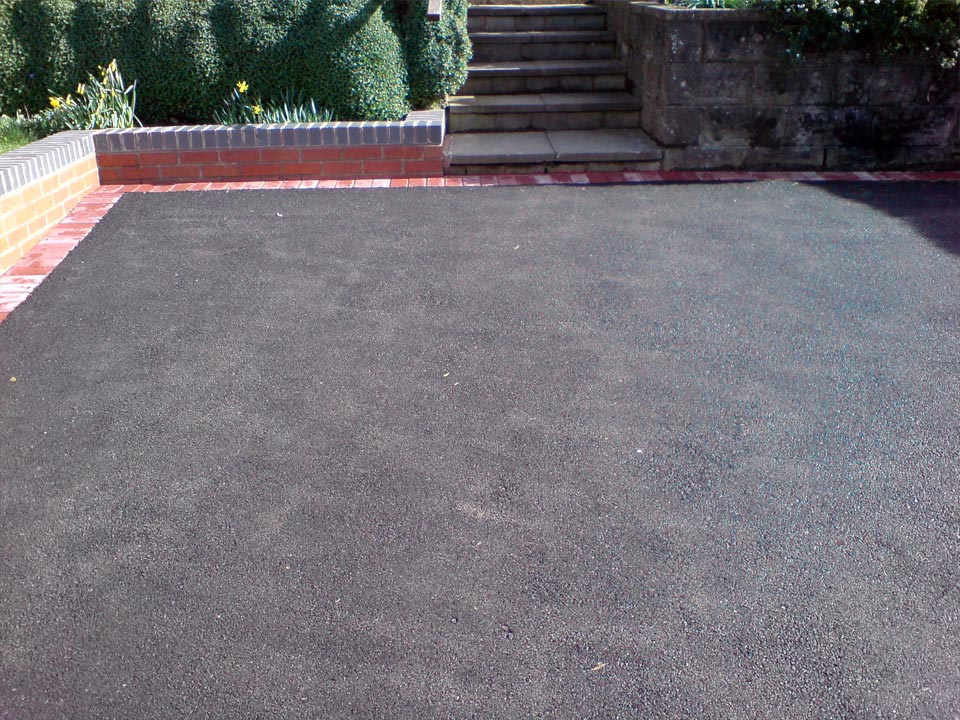 Tarmac With A Red Block Paving Edge
